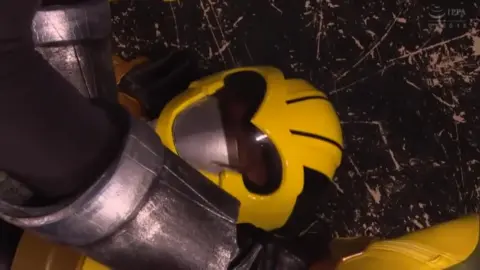 Asian Cosplay Fight Scene with Gun and Fetish Footwear