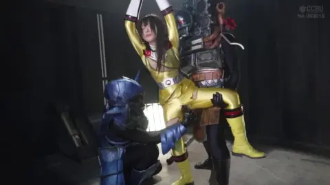 Asian Performers in Elaborate Costumes