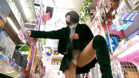 Asian Teen in Store Aisle