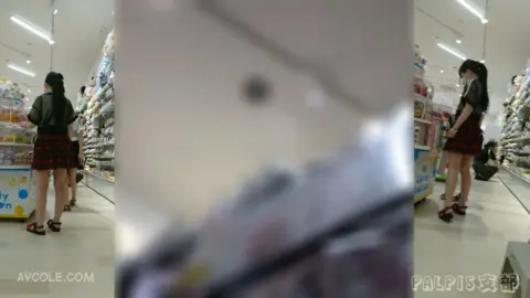 Schoolgirls in Uniform Play at Arcade