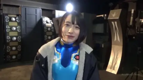 Asian Duo in Costumes with Male Partner