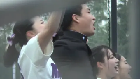 Asian Cheerleaders in White Outfits