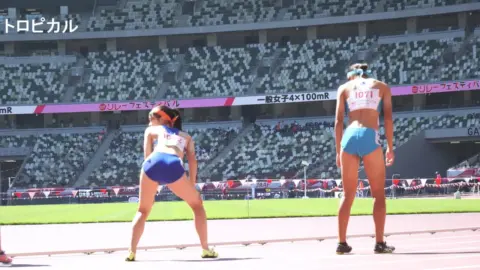 Asian Athletes in Sports Stadium