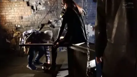 Masks and Restraint in Dark Room