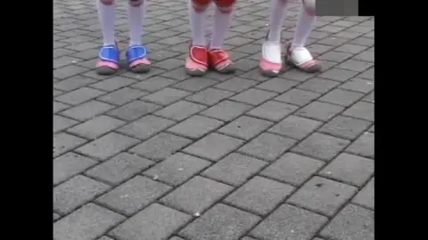 Asian Women in Costumes Engage in Fight Scenes Outdoors