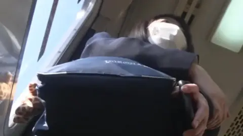 Asian Teen Schoolgirl in Uniform on Train