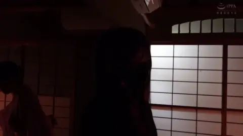 Asian Woman in Traditional Room