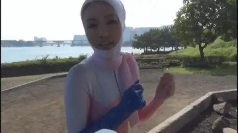 Asian Duo in Pink Bodysuits Outdoor Encounter