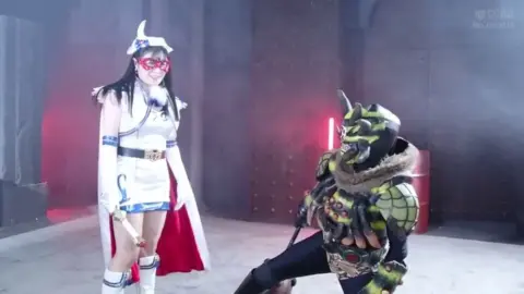 Asian cosplayers in industrial setting