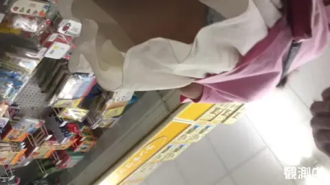 Asian Girl Shopping in Store