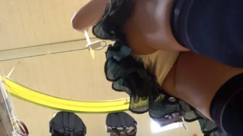 Asian Girl in Clothing Store