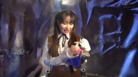 Asian Couple in Futuristic Control Room Scene