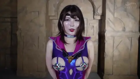 Asian Girl in Purple and Pink Costume