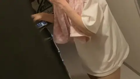 Asian Girl Washing Face in Bathroom