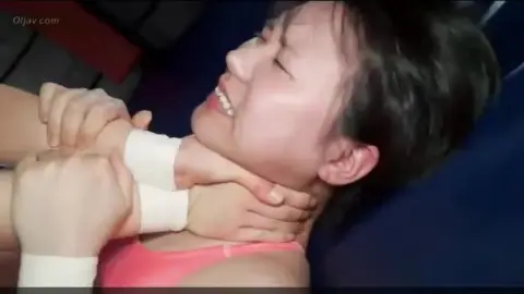 Asian Wrestlers Engage in Intense Match