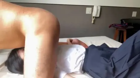 Asian Couple Intimate Moments in Bedroom