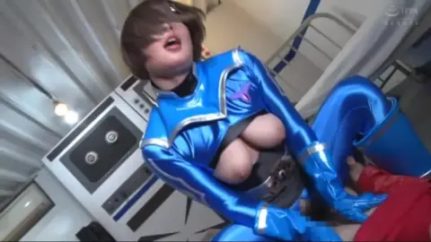 Asian Women in Metallic Costumes Engage in Intimate Acts