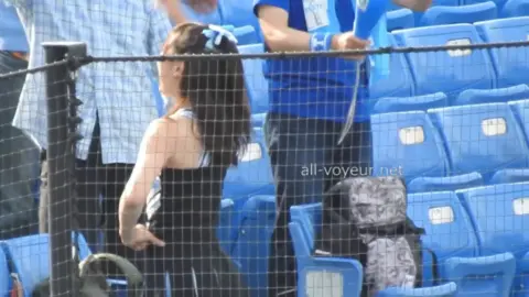 Asian Cheerleaders in Black and Blue Uniforms