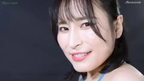 Asian Couple Engaged in Wrestling Match