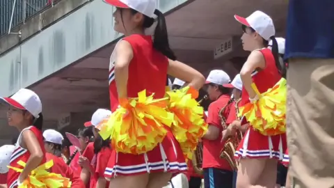 Asian Teenagers in Uniform Dance