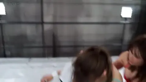 Asian Lesbians Wrestling in Sports Attire