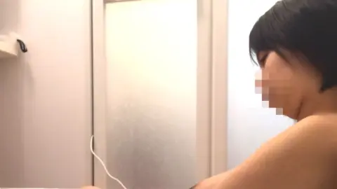 Asian Teen Washing Face and Urinating
