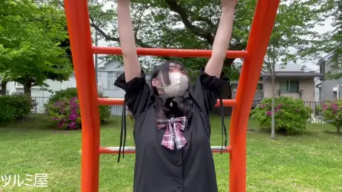 Asian Teen Plays in Playground