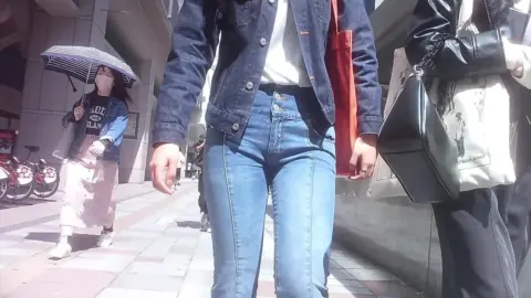 Asian Girls with Face Masks Walking on City Street