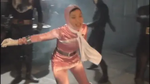 Asian Performers in Costume and Restraints