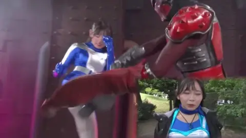 Asian Women in Costume Pose with Weapons