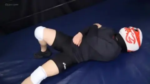Asian Couple in Wrestling Ring – Choking and Distress