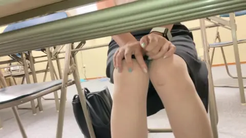 Asian Schoolgirl Sitting Pose
