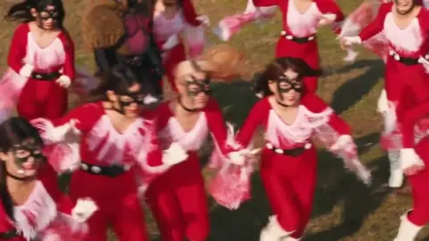 Asian Girls in Masks and Costumes