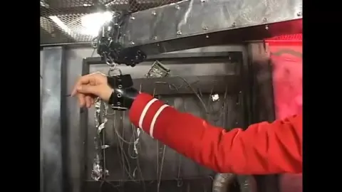 Asian Woman in Industrial Setting