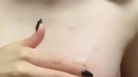 Asian Teen Seduces with Topless Poses