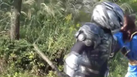 Asian Performers in Cosplay Fighting Scene