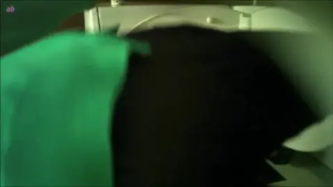 Asian Couple Intimacy in Bedroom