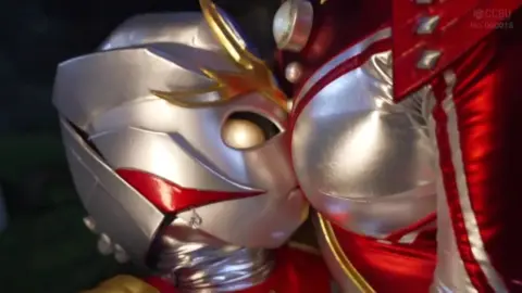 Muscular Asian Men in Red and Silver Costumes