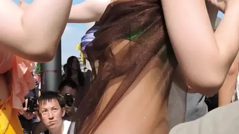 Girls Adjusting Outfits