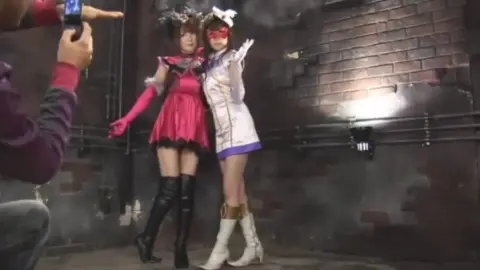 Lesbian Duo in Costume Embrace