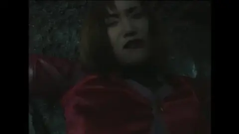 Dark-Haired Asian Woman in Red Jacket and Fishnet