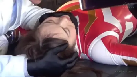 Asian Girl in Red Bikini Restrained by Men in Masks