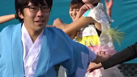Asian Performers Dancing by the Pool
