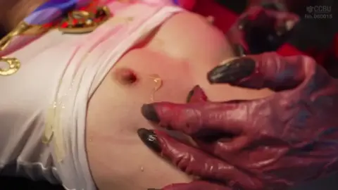 Asian Woman in Sci-Fi Setting with Tentacle Object