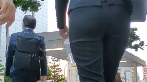 Asian Businesswoman in Black Suit