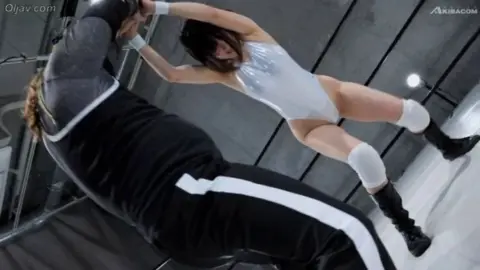 Asian Lesbians Wrestling in Ring