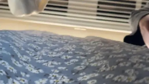 Slim Caucasian Woman in White Underwear on Bed