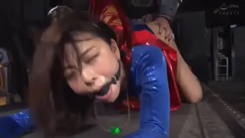 Asian Women in Superman Costume BDSM Scene