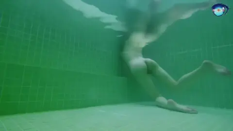 Blonde Bombshell in Indoor Pool