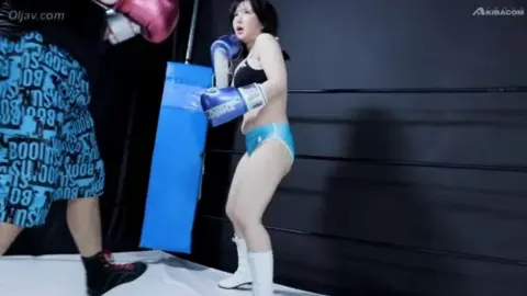 Asian Boxing Duo in Ring